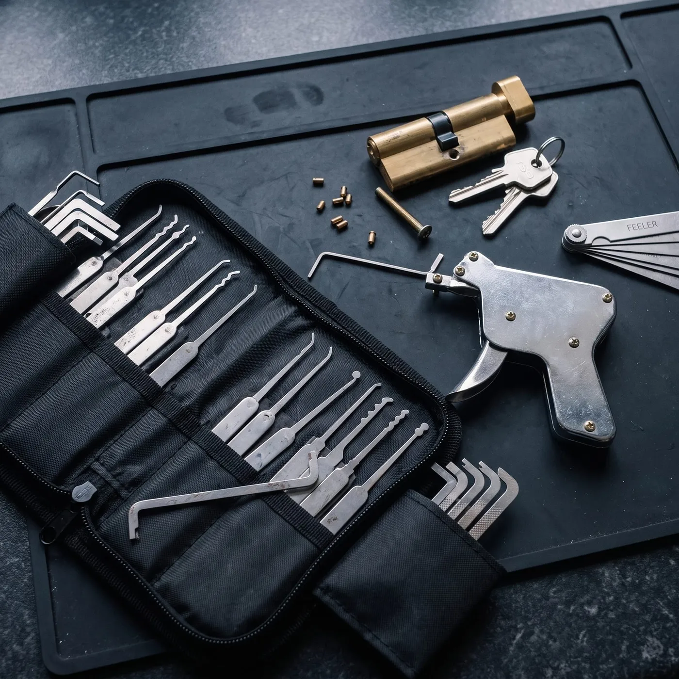 Professional entry and pick tools laid out on the workbench